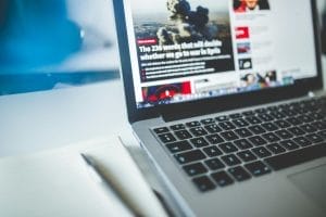 Gray Laptop Computer Near Journals