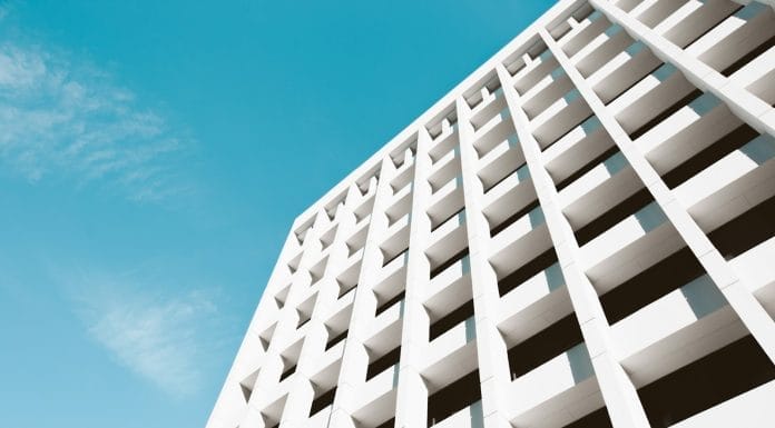 low angle photography of white building under blue sky